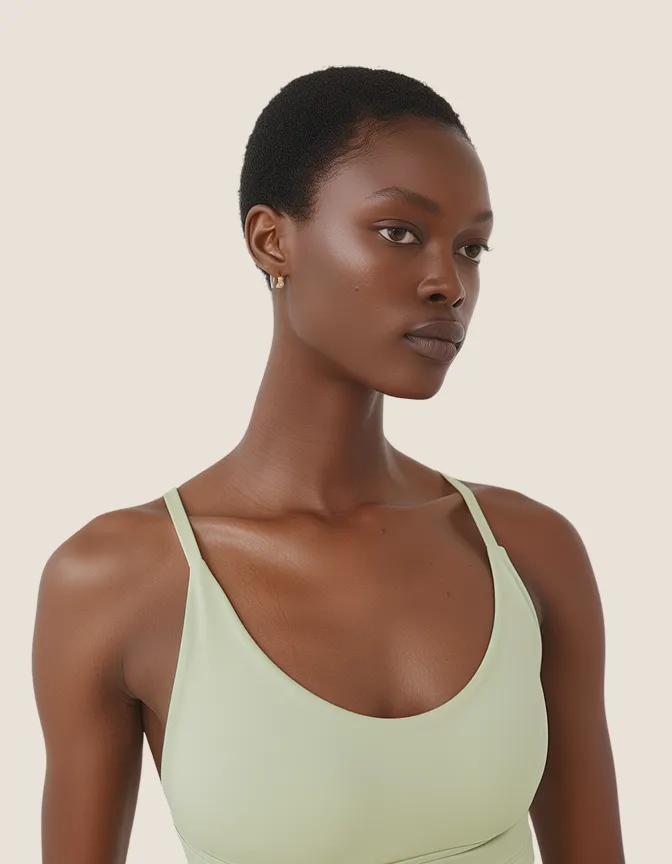 Yoga teacher portrait in white tank top